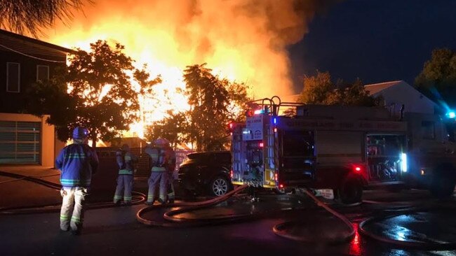 Firefighters at the scene of a huge house fire on Winchester Street at Hamilton. Picture: Glen Norris