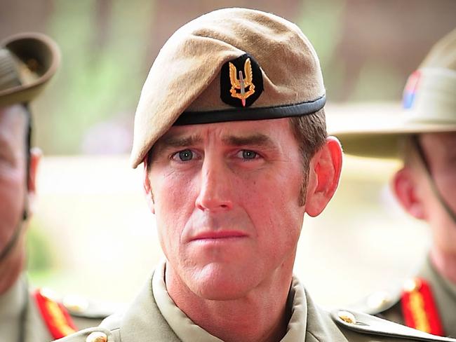 Australian Army soldier Corporal Benjamin Roberts-Smith, VC, MG, takes a seat after being awarded the Victoria Cross for Australia during the investiture ceremony in Perth on 23 January 2011. *** Local Caption *** The Governor-General of the Commonwealth of Australia held an investiture ceremony at Campbell Barracks in Perth to award a Victoria Cross for Australia to Corporal Benjamin Roberts-Smith, VC, MG, on 23 January 2011.  Corporal Benjamin Roberts-Smith, VC, MG, from the Special Air Service Regiment was awarded the Victoria Cross for Australia for his gallantry under fire during operations in Afghanistan in June 2010.    Present at the ceremony were the Governor-General of the Commonwealth of Australia, Her Excellency Ms Quentin Bryce AC; Prime Minister of Australia the Hon. Julia Gillard MP; Leader of the Opposition the Hon. Tony Abbott MP; Minister for Defence the Hon. Stephen Smith MP; Minister for Defence Science and Personnel the Hon Warren Snowdon MP; Governor of Western Australia, His Excellency Dr Ken Michael AC; Premier of Western Australia the Hon. Colin Barnett MLA; Ambassador of the Islamic Republic of Afghanistan, his Excellency Dr Amanullah Jayhoon; Member for Curtin the Hon. Julie Bishop MP; Chief of the Defence Force, Air Chief Marshal Angus Houston AC AFC; Chief of Army, Lieutenant General Ken Gillespie AO DSC CSM; and Special Operations Commander Australia, Major General Gus Gilmore DSC.  The Victoria Cross for Australia is our highest honour. It is only awarded to those who display the most conspicuous gallantry and daring in the face of the enemy. Corporal Benjamin Roberts-Smith, VC, MG, becomes the 98th Australian recipient of the award and the second recipient of the Victoria Cross for Australia since it was instituted in 1991. Picture: Department of Defence