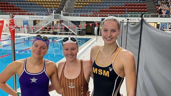 Elena Staal, left, Lilly Carrick and Hannah Casey all placed in the 100m freestyle.