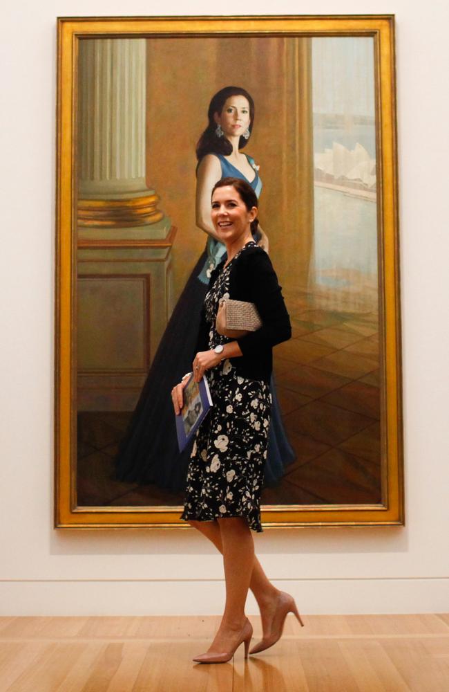 Princess Mary stands in front of a painting of herself painted by artist Jiawei Shen at the Portrait Gallery in Canberra. Picture: Lukas Coch/Getty Images