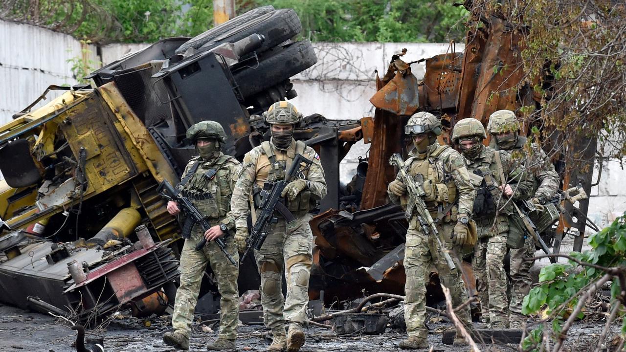 Russian servicemen patrol a destroyed part of Mariupol after the city was overtaken by the Russians. Picture: Olga Maltseva / AFP.