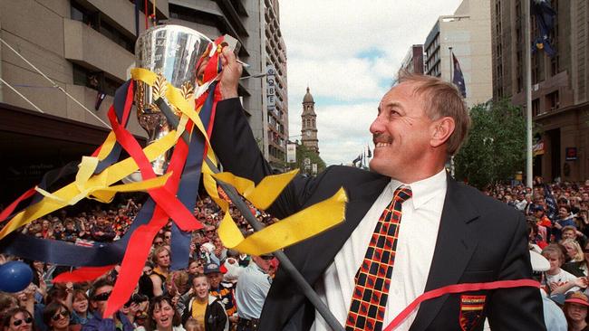 Malcolm Blight holding the premiership trophy during a street parade after the Crows’ 1997 triumph. Picture: Chris Mangan