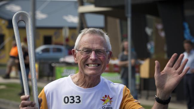 Batonbearer Tony Strahan carrying the Baton as the Queen's Baton Relay visited Torquay.