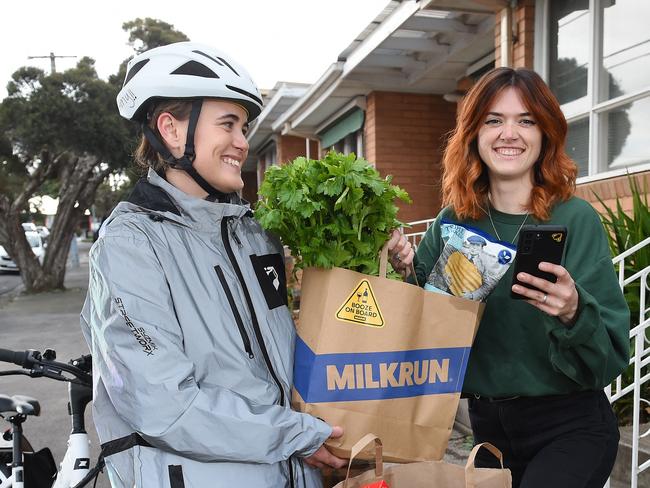 Milkrun delivery service is in the top 50 tech startups. Milkrun rider Amy Farnsworth making delivery to Lauren Mason. Picture: Josie Hayden