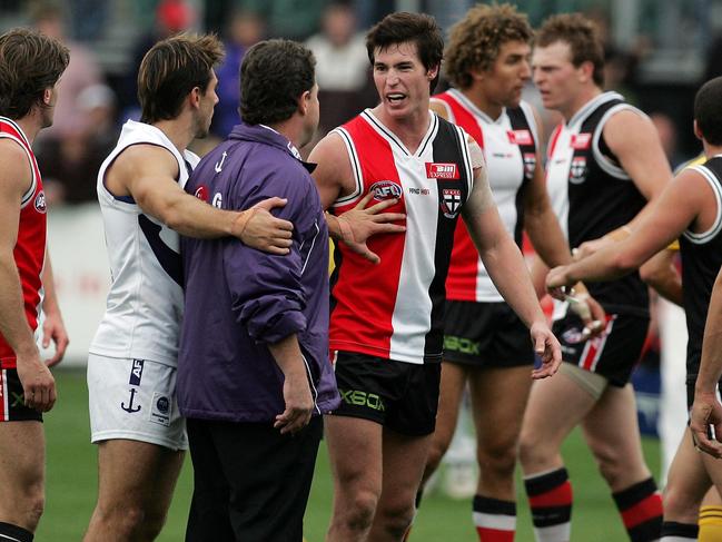 Fremantle’s Heath Black holds back coach Chris Connolly from an angry Lenny Hayes on the ground after ‘Sirengate’ against St Kilda in Launceston in 2006.