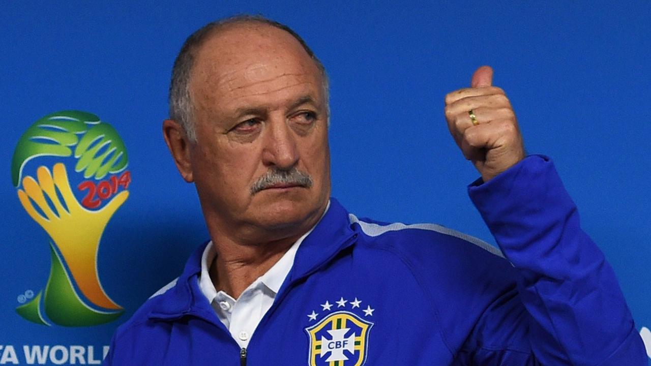 Brazil's coach Luiz Felipe Scolari leaves after a press conference in SaoFBL-WC-2014-BRA-PRESSER Paulo, Brazil on June 11, 2014 on the eve of the opening match of the 2014 FIFA World Cup between Brazil and Croatia. AFP PHOTO / PEDRO UGARTE