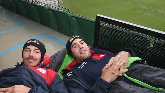 Melbourne players Christian Petracca and Michael Hibberd brave the cold at the MCG ahead of this year’s Sleep at the ‘G. Picture: David Crosling