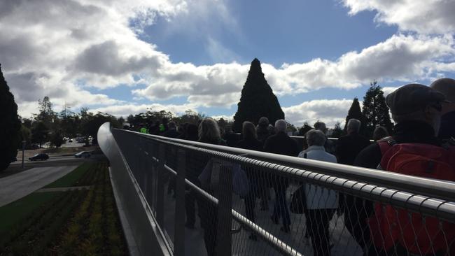 Hobartians cross the Bridge of Remembrance after it's official opening. Picture: JIM ALOUAT