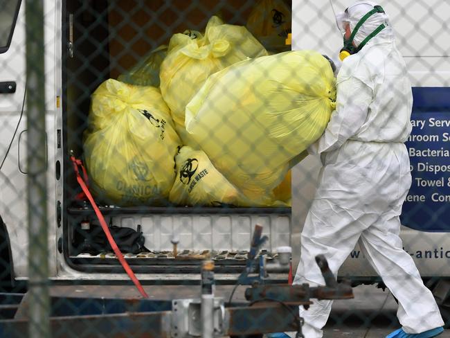 Medical waste is removed from the St Basil's Home for the Aged in the Melbourne suburb of Fawkner on July 27, 2020, with 84 cases of the COVID-19 coronavirus linked to the facility. - The Australian state of Victoria has recorded 532 new coronavirus cases, the highest one-day total in the state since the pandemic started. (Photo by William WEST / AFP)