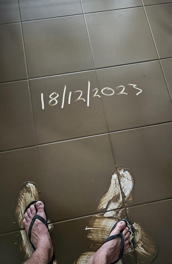 Local hero of the Cairns floods Dan Cairns, who rescued 19 people at Holloways Beach on his kayak, also dealt with 20 centimetres of water sweeping through his own rental house, leaving a think layer of mud and destroying much of the furniture. Picture: Supplied