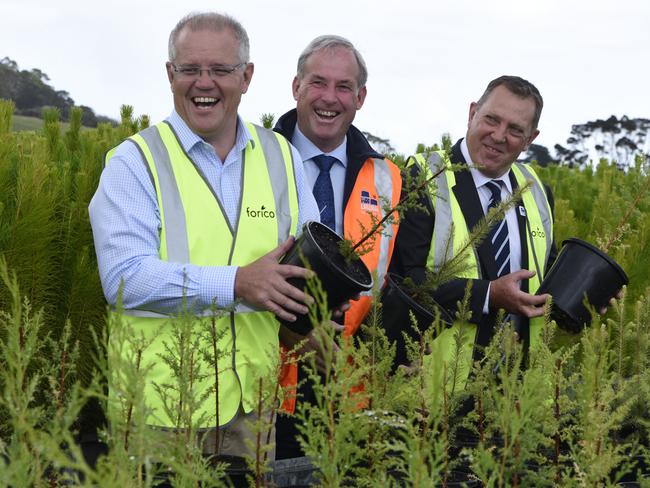 (Prime Minister Scott Morrison, Senator Richard Colbeck and Liberal candidate for Braddon Gavin Pearce at the Forico Nursery in Somerset, Tasmania yesterday. Picture: Sarah Rhodes