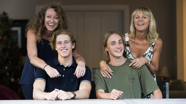 Young HSC inventors Oliver Bowman, with his mum Kim Bowman, and Tom Denny, with his mum Paula Denny. Picture: Dylan Robinson