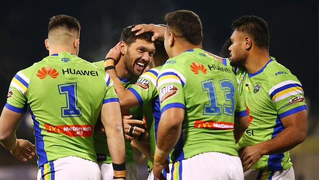 Jordan Rapana and the Raiders celebrate a try against the Cowboys.