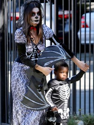 Sandra Bullock is the epitome of cool mum. She went all out when taking son Louis to a Halloween party at his school. Picture: AKM-GSI/Splash News