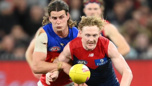 Clayton Oliver and Jarrod Berry go head-to-head on Friday night. Picture: Quinn Rooney/Getty Images