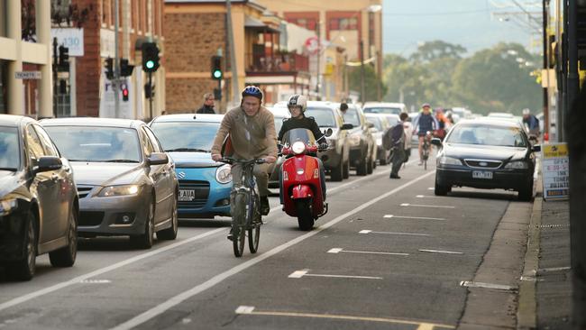 A motorised scooter rides along a bike lane in Pirie St. Picture: Tait Schmaal