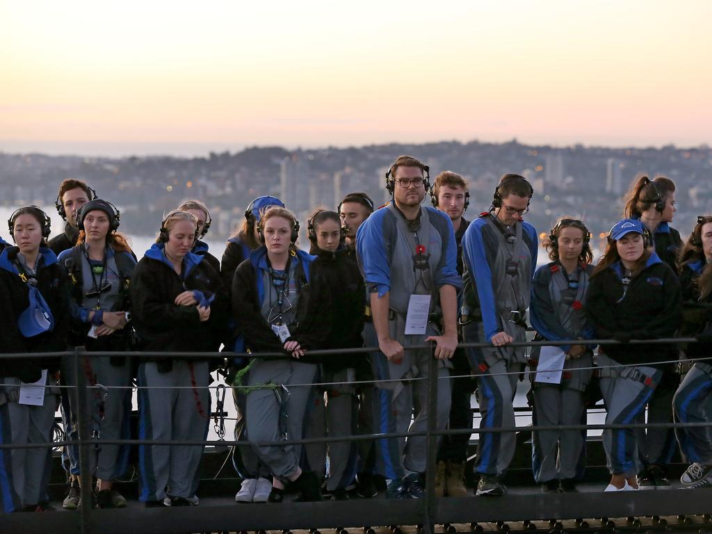 A dawn service was held on the summit of the Sydney Harbour Bridge to commemorate ANZAC Day. Money raised by the members of the public who climbed the bridge went to RSL DefenceCare. Picture: Toby Zerna