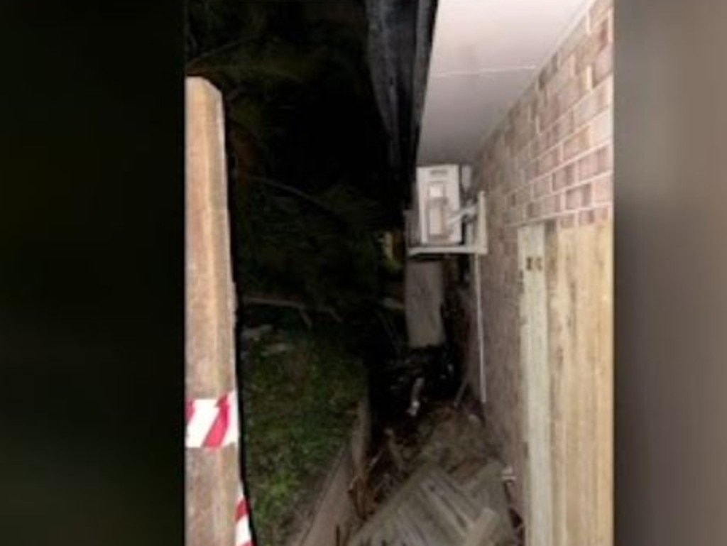 The car ended up wedged between two properties. Picture: 7News