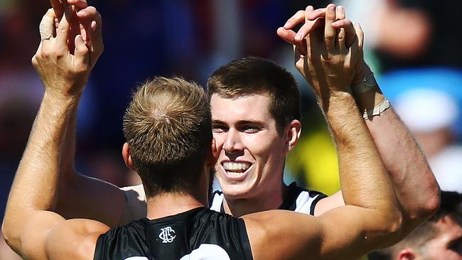 Mason Cox celebrates one of his four goals with Ben Reid. Pic: Getty Images