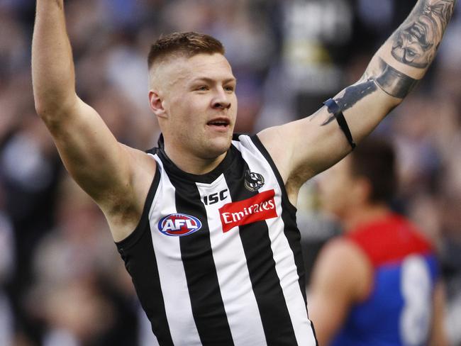 Jordan De Goey of the Magpies celebrates a goal during the Round 12 AFL match between the Collingwood Magpies and the Melbourne Demons at the MCG in Melbourne, Monday, June 10, 2019. (AAP Image/Daniel Pockett) NO ARCHIVING, EDITORIAL USE ONLY