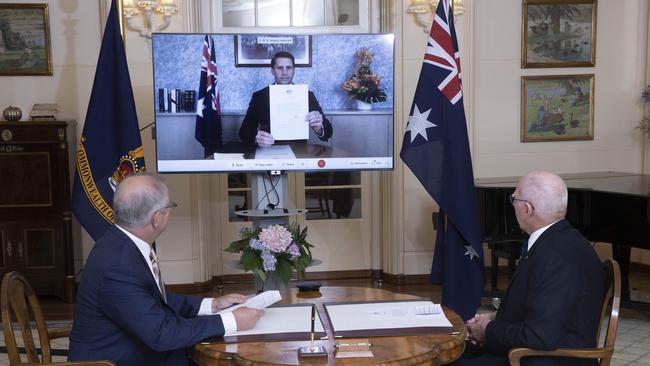 Prime Minister Scott Morrison, left, with the Governor-General David Hurley during a swearing-in ceremony for Andrew Hastie at Government House, Canberra. Picture: NCA NewsWire / Gary Ramage