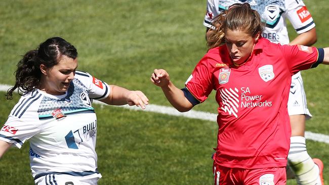 Sofia Huerta of Adelaide United and Alexandra Natoli of Melbourne Victory competes for the ball.