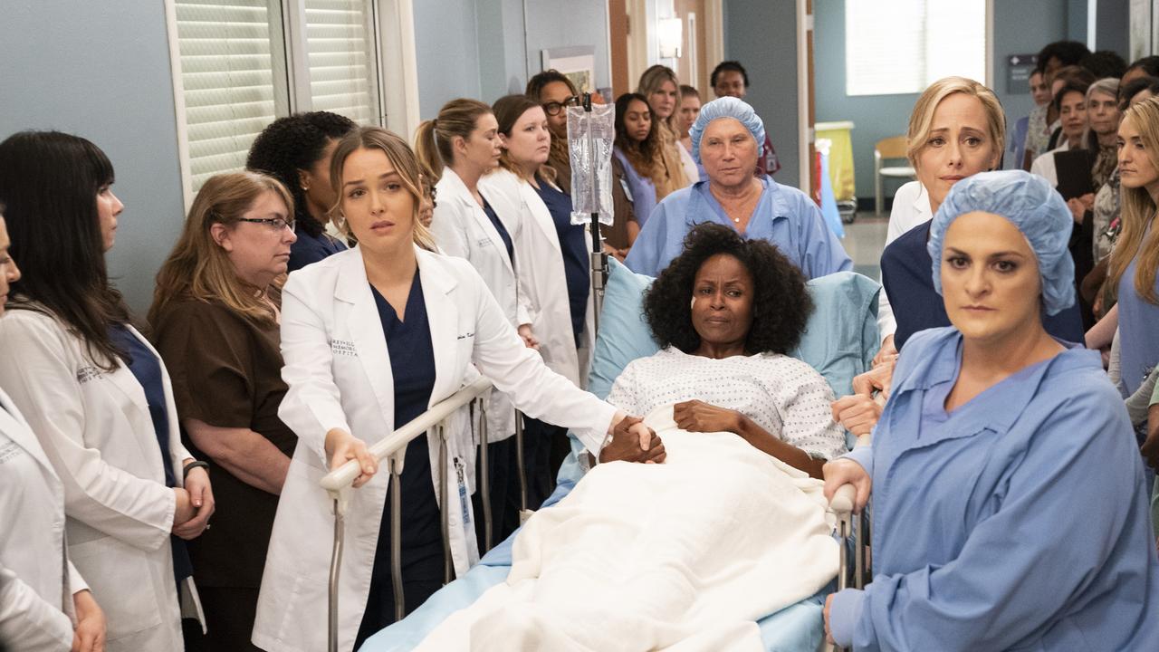 Elisabeth Finch (pictured right, in the scrub cap) on the set of Grey’s Anatomy. Picture: Getty
