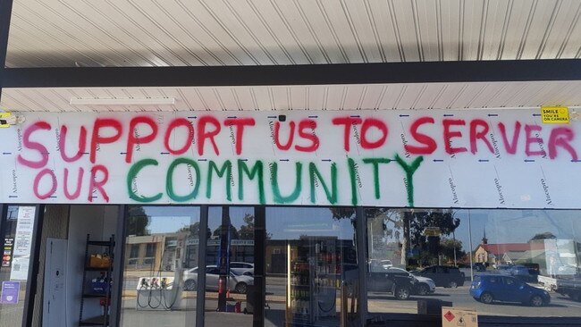 Disgruntled owner Emmanuel Pishas spray-painted a series of messages across service station fences and installed signs accusing the council of wasting rates on the appeal. Picture: Supplied