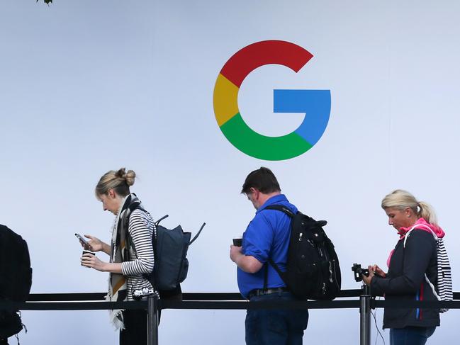 (FILES) In this file photo taken on October 4, 2017, attendees wait in line to enter a Google product launch event at the SFJAZZ Center in San Francisco, California. - Google parent Alphabet on February 2, 2021, reported that its quarterly profit rocketed some 50 percent to $15.2 billion at the end of last year as its digital ad business thrived. (Photo by Elijah Nouvelage / AFP)