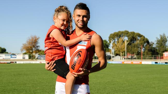 North Adelaide’s Robbie Young with his five-year-old daughter, Nayari, at Prospect Oval. Picture: AAP/Morgan Sette