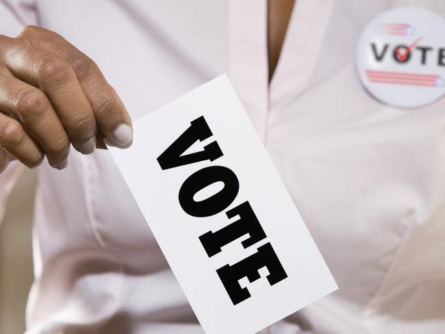 Thinkstock generic image of woman voting in ballot box.