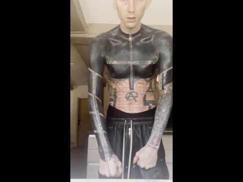 Music star tattoos body black in transformation