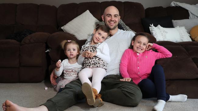 Liam Fulton with his daughters Taya (1), Zali (3) and Mackenzie (5). Picture: Brett Costello