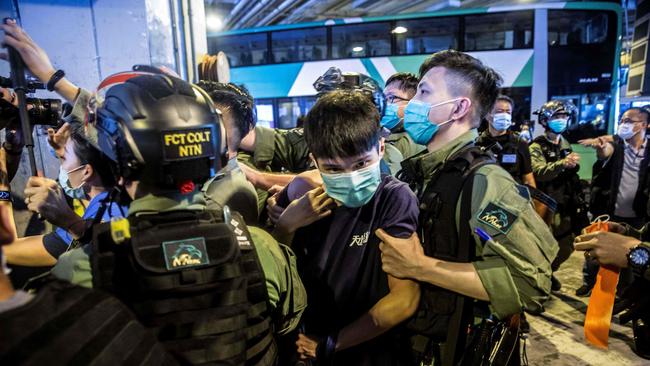 Riot police detain a young man during a protest in Hong Kong last week. Picture: AFP