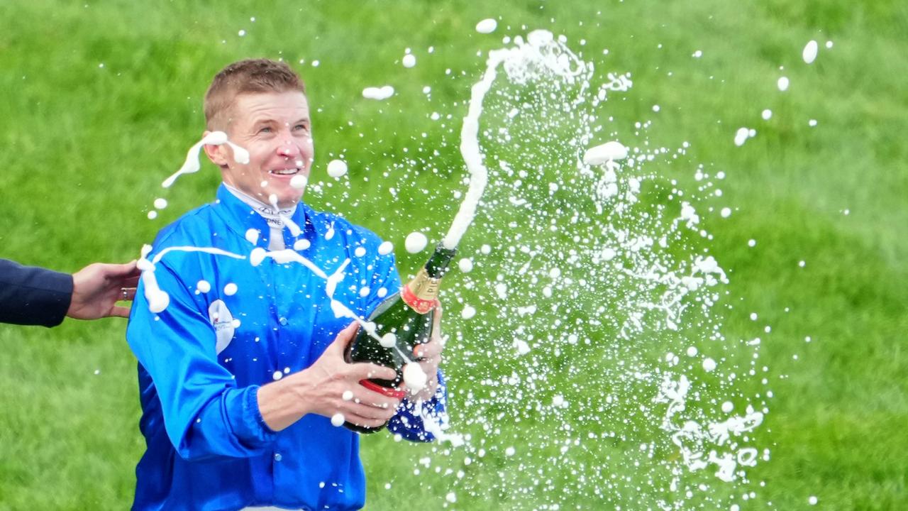 James McDonald sprays champagne after riding Anamoe to win the Ladbrokes Cox Plate at Moonee Valley Racecourse on October 22, 2022 in Moonee Ponds, Australia. (Photo by Scott Barbour/Racing Photos via Getty Images)