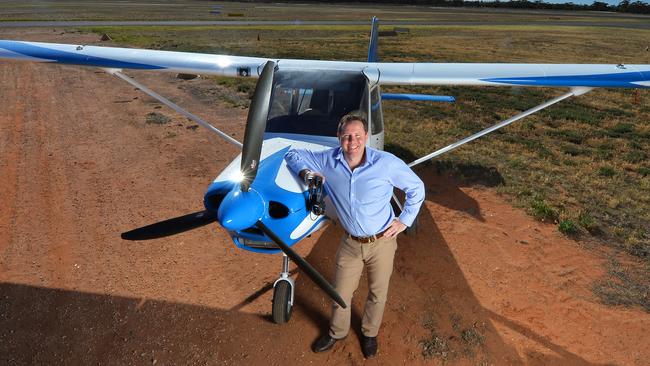 Andrew Broad with his two-seater plane which he flies around his electorate. Picture: Rob Leeson.