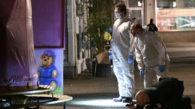 Forensic police inspect the crime scene. Picture: AFP