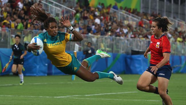 Ellia Green of Australia dives in to score a try against Patricia Garcia of Spain during the quarter final.