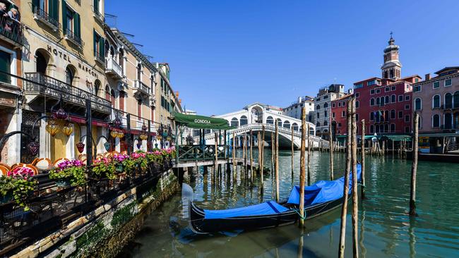 Venice’s canals are no longer a murky green, polluted with diesel and sediment. Picture: AFP