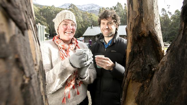 Rowena Goldsmith and Brett Sinclair, from Teesdale in Victoria, enjoy a hot drink while braving the cold weather at The Springs on kunanyi/Mt Wellington. Picture: EDDIE SAFARIK