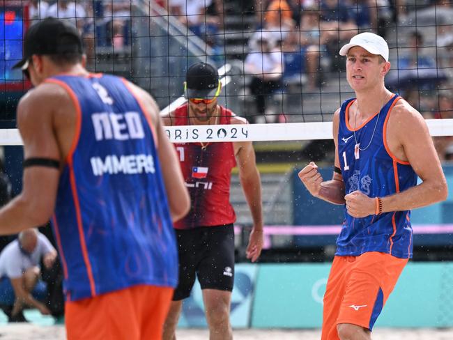 Van De Velde and Netherlands' #02 Matthew Immers celebrate a point during the match. Picture: Kirill Kudryavtsev/AFP