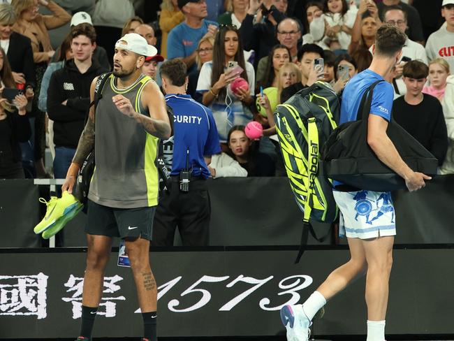 MELBOURNE, AUSTRALIA - JANUARY 16: Nick Kyrgios and Thanasi Kokkinakis of Australia acknowledge the crowd as they leave John Cain Arena after retiring in the Men's Doubles First Round match against James Duckworth and Aleksandar Vukic of Australia during day five of the 2025 Australian Open at Melbourne Park on January 16, 2025 in Melbourne, Australia. (Photo by Cameron Spencer/Getty Images)