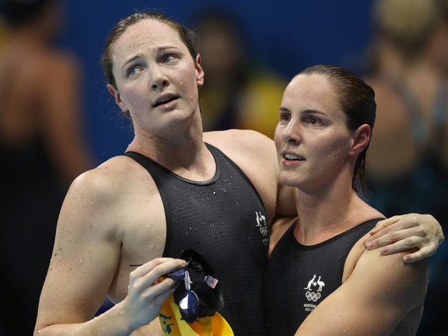 Cate Campbell with sister Bronte after finishing sixth and fourth in the Women’s 100m Freestyle Final on day six of the swimming at the Rio 2016 Olympic Games. Picture: Brett Costello