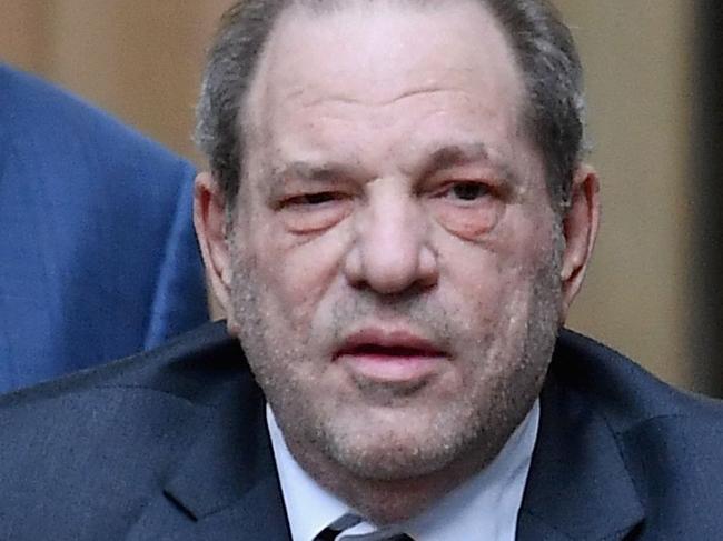 (FILES) In this file photo taken on February 20, 2020, Harvey Weinstein (C) uses a walker as he leaves Manhattan Criminal Court after the third day of jury deliberations in his sex crimes trial in New York. - Weinstein pleaded not guilty in a courtroom in Los Angeles on July 21, 2021, to all 11 charges of rape and sexual assault against five women in California hotel rooms. The convicted rapist who is already serving 23 years has been brought back to the city where he once presided over massive, industry-shaking film deals to face more charges that could result in an additional 140 years in prison. (Photo by Angela Weiss / AFP)