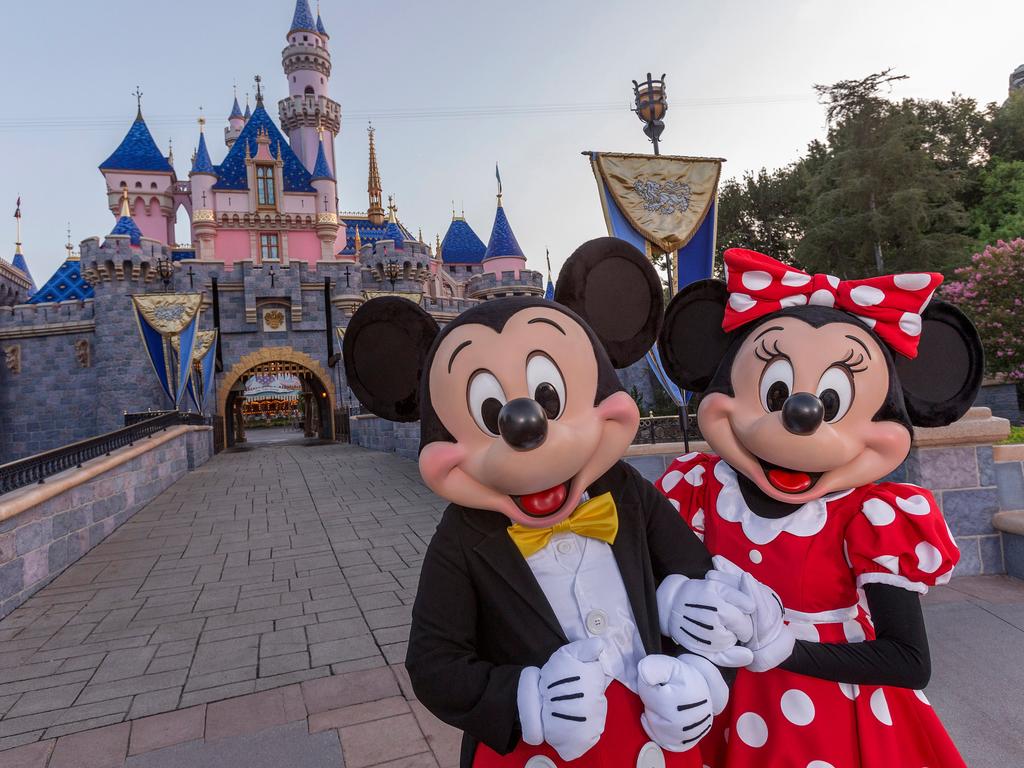 ESCAPE:  Standing in front of Sleeping Beauty Castle at Disneyland Park, Mickey Mouse and Minnie Mouse welcome visitors from all over the world. Combining classic favorites and exciting additions, the Disneyland Resort is an essential part of a Southern California vacation. (Joshua Sudock/Disneyland Resort)