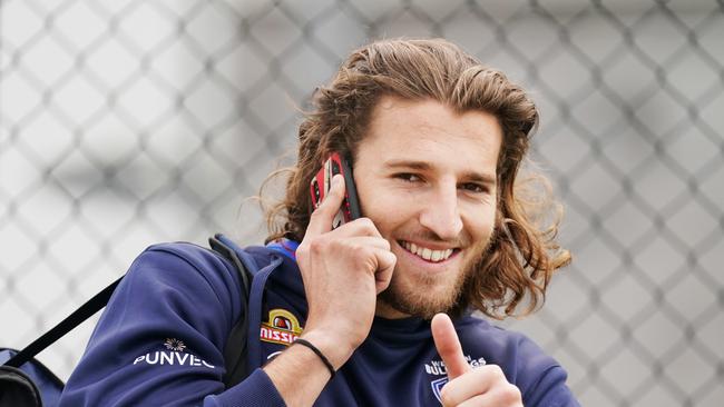 Marcus Bontempelli of the Bulldogs gestures to media during an AFL Bulldogs training session at VU Whitten Oval in Melbourne, Friday, May 22, 2020. (AAP Image/Michael Dodge) NO ARCHIVING