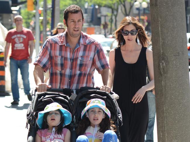 Adam Sandler chooses to push his daughters Sunny Madeline Sandler and Sadie Madison Sandler himself.