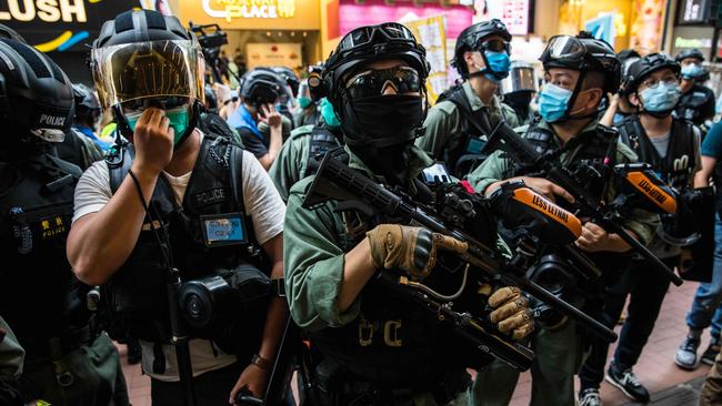 Riot police clear a Hong Kong street. Picture: AFP