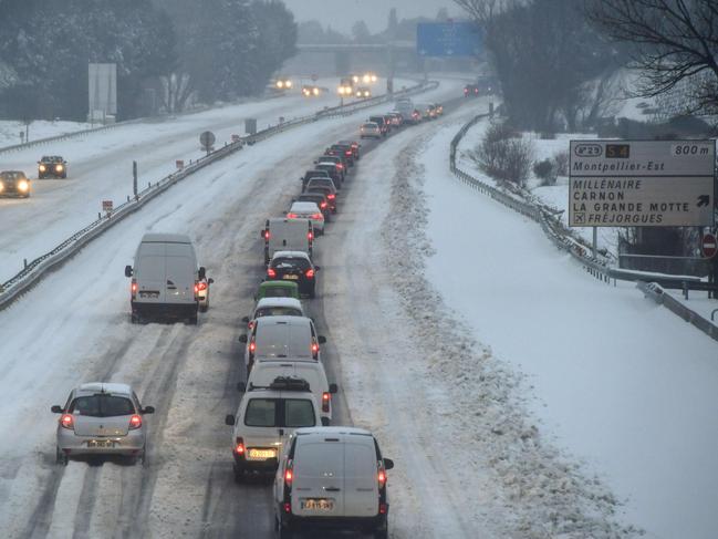 Traffic in the snow on the A9 motorway near Montpellier in the south of France. Countries across Europe shut schools and rushed to shelter homeless people as a deadly blast of Siberian weather dubbed the “Beast from the East” kept the mercury far below zero. Picture AFP
