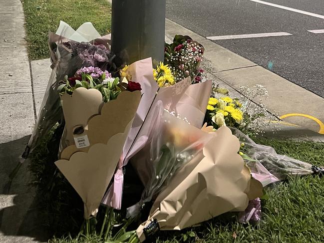 Flowers at the scene of an accident on Smith St in Southport where a pedestrian lost his life. Picture: Keith Woods.